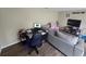 Living room with comfortable seating, laminate flooring and space for an office area at 3509 Lisa Ln, Lakeland, FL 33801