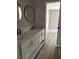 Modern bathroom featuring a double sink vanity, updated fixtures, and sleek mirrors at 5356 Spivey Glen Ct, Lakeland, FL 33810
