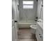 Clean bathroom featuring new tile, white vanity, updated flooring and modern fixtures at 5356 Spivey Glen Ct, Lakeland, FL 33810