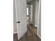 Bright hallway with neutral paint, white trim, and updated flooring throughout the house at 5356 Spivey Glen Ct, Lakeland, FL 33810