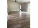 Spacious living room with sleek floors, neutral paint, and lots of natural light at 5356 Spivey Glen Ct, Lakeland, FL 33810