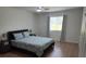 Relaxing bedroom with a ceiling fan, natural light, and hardwood floors at 535 Midway Dr # A, Ocala, FL 34472