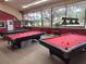 Billiards room with multiple tables, offering a recreational space for residents to enjoy games and socializing at 535 Midway Dr # A, Ocala, FL 34472