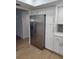 Kitchen showcasing stainless steel refrigerator, stylish cabinets, and modern finishes for a sleek look at 535 Midway Dr # A, Ocala, FL 34472