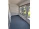 Enclosed sun room featuring neutral carpeting and natural light at 535 Midway Dr # A, Ocala, FL 34472