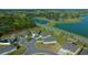 Beautiful aerial view of homes, lake, and landscaping in a well-planned community at 6185 Sw 89Th Ct, Ocala, FL 34481