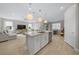 Bright, open kitchen with an island, stainless steel appliances, and seamlessly connects to the living and dining areas at 6185 Sw 89Th Ct, Ocala, FL 34481