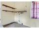 Utility room area with shelving, exposed plumbing, and a window at 641 Jackson St, Eustis, FL 32726