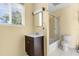 Bathroom features single sink, a mirror, toilet, and a tub with shower at 641 Jackson St, Eustis, FL 32726