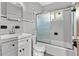 Bathroom featuring a shower with glass doors, toilet, and single sink at 641 Jackson St, Eustis, FL 32726