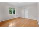 Bright bedroom features hardwood floors and a large window with natural light at 641 Jackson St, Eustis, FL 32726