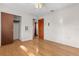 Bedroom with hardwood floors, neutral wall paint, and a closet with sliding doors at 641 Jackson St, Eustis, FL 32726