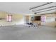 Spacious garage with windows, shelves, and plenty of room for parking at 641 Jackson St, Eustis, FL 32726
