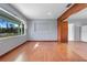 Spacious living room featuring wood floors, an extra large window, and neutral wall paint at 641 Jackson St, Eustis, FL 32726