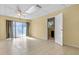 Large open living area featuring tile floor, curtains and a ceiling fan at 641 Jackson St, Eustis, FL 32726