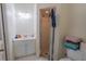 Bright bathroom features a white vanity with sink, toilet, and glass-enclosed shower at 1695 Horseshoe Rd, Deltona, FL 32725