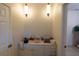 Well-lit bathroom with vanity, sink, and modern fixtures at 1695 Horseshoe Rd, Deltona, FL 32725