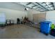 Spacious garage with overhead door, ample storage space, and room for projects at 1695 Horseshoe Rd, Deltona, FL 32725
