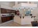 Well-appointed kitchen with granite countertops, wood cabinets, and modern appliances at 1695 Horseshoe Rd, Deltona, FL 32725
