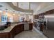 Modern kitchen with stainless steel appliances, granite counters, and ample cabinet space at 1695 Horseshoe Rd, Deltona, FL 32725