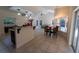 Open floorplan with kitchen island, granite countertops, and stainless steel appliances at 1695 Horseshoe Rd, Deltona, FL 32725
