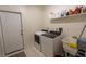 Bright laundry room with modern washer and dryer units, with sink at 1695 Horseshoe Rd, Deltona, FL 32725
