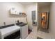 Utility room featuring modern appliances, and storage space at 1695 Horseshoe Rd, Deltona, FL 32725