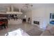 Open concept living space with fireplace and direct kitchen and dining room access at 1695 Horseshoe Rd, Deltona, FL 32725