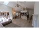 Open floor plan with kitchen island, dining area, and fireplace for seamless living at 1695 Horseshoe Rd, Deltona, FL 32725