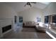 Bright living room features high ceilings, fireplace, and access to outdoor patio at 1695 Horseshoe Rd, Deltona, FL 32725