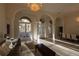 Bright and airy living room featuring grand archways, tile flooring, and abundant natural light at 1695 Horseshoe Rd, Deltona, FL 32725