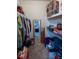 Walk-in closet with ample storage and shelves, perfect for organizing clothing and accessories at 1695 Horseshoe Rd, Deltona, FL 32725