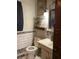 Compact bathroom with vintage fixtures, subway tile, and decorative accents, functional and efficient at 705 Grape Ave, St Cloud, FL 34769