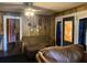 Inviting living room with paneled walls, vintage furnishings, and a door adding character at 705 Grape Ave, St Cloud, FL 34769