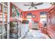 Bedroom featuring colorful walls, a large window, and a vintage-style metal bed frame with patterned bedding at 9107 Sw 102Nd Cir, Ocala, FL 34481