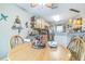 Charming breakfast nook featuring a round wooden table and built-in shelving for a cozy dining experience at 9107 Sw 102Nd Cir, Ocala, FL 34481