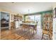 Inviting dining room featuring hardwood floors, sliding glass doors and backyard access for Gathering gatherings at 9107 Sw 102Nd Cir, Ocala, FL 34481