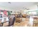 Large living room with hardwood floors, comfortable seating, and lots of space at 9107 Sw 102Nd Cir, Ocala, FL 34481