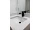 New bathroom sink featuring stylish black fixtures and a gray, white, and black countertop at 991 Polk St, Bartow, FL 33830