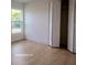 Bright bedroom featuring wood-look floors and a large window allowing plenty of natural light at 991 Polk St, Bartow, FL 33830