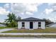 Charming single-story home featuring a freshly painted exterior, a modern roof and landscaped front yard at 991 Polk St, Bartow, FL 33830