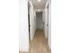 Hallway featuring newly installed wood-look floors and freshly painted white walls at 991 Polk St, Bartow, FL 33830