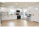 New kitchen with stainless appliances, white cabinets and quartz countertops at 991 Polk St, Bartow, FL 33830