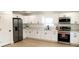 New kitchen with stainless appliances, white cabinets and quartz countertops at 991 Polk St, Bartow, FL 33830