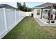 Fenced backyard, with a grill under a pergola, offers privacy and entertainment space at 10470 Sw 132Nd Ct, Dunnellon, FL 34432