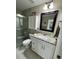 Bathroom featuring granite countertops, and a modern vanity with white cabinets at 10470 Sw 132Nd Ct, Dunnellon, FL 34432
