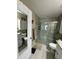Bathroom featuring a tiled shower, granite countertops, and a modern vanity at 10470 Sw 132Nd Ct, Dunnellon, FL 34432