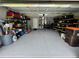 Spacious garage featuring epoxy flooring with ample storage and organization solutions at 10470 Sw 132Nd Ct, Dunnellon, FL 34432