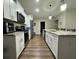 Spacious kitchen with granite countertops, stainless steel appliances and white cabinetry at 10470 Sw 132Nd Ct, Dunnellon, FL 34432