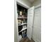 Pantry with shelves stocked with various food items and household supplies at 10470 Sw 132Nd Ct, Dunnellon, FL 34432